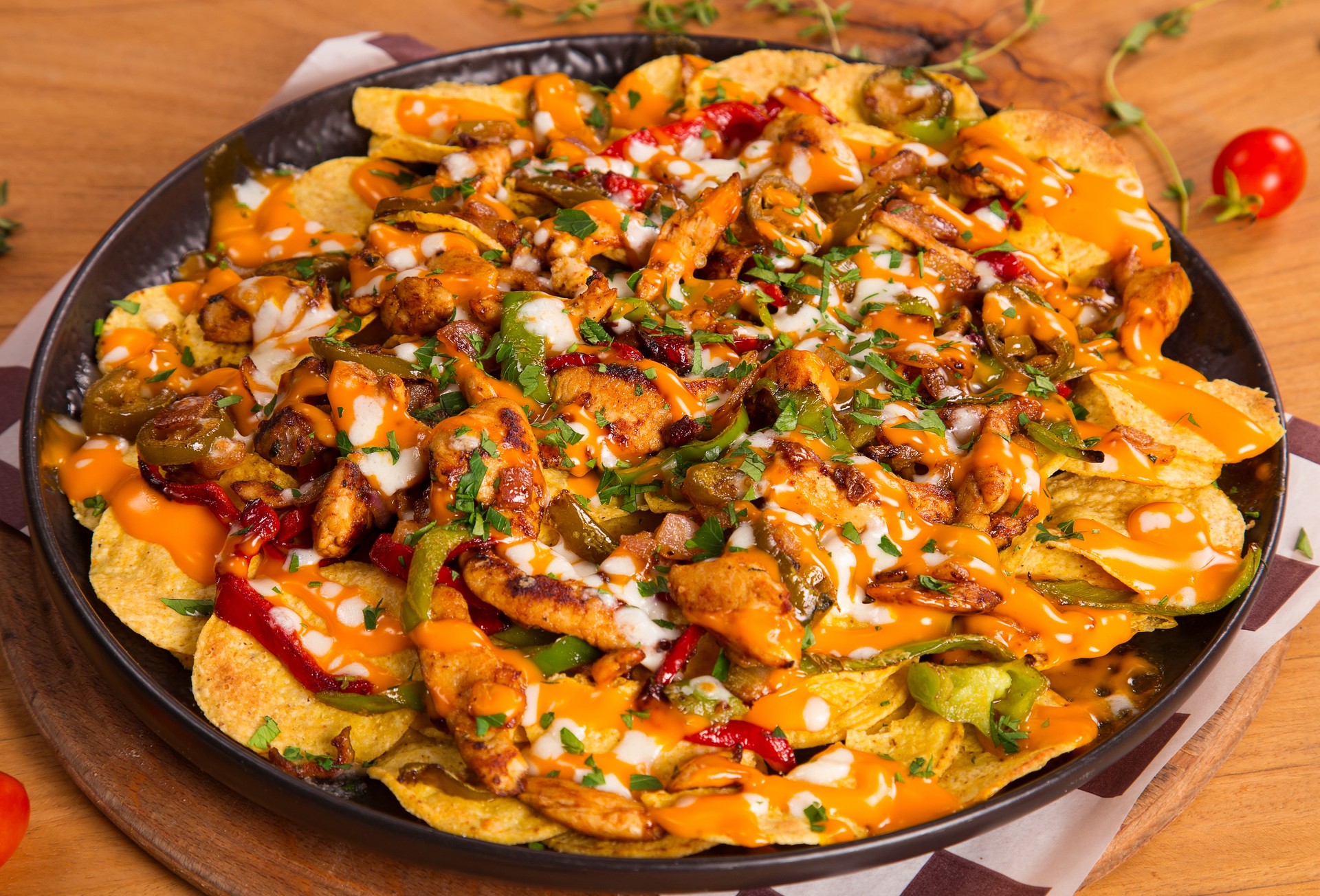 Mexican food with spicy chicken, red pepper and chips